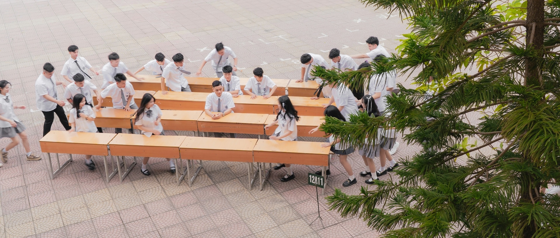 Children in school uniforms at the gate of an international school campus in Ho Chi Minh City's District 2