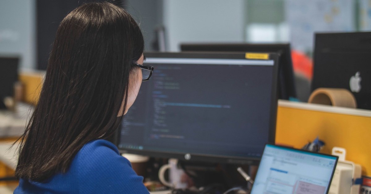 Foreigner working at a laptop in a café near the Tonle Sap riverfront in Phnom Penh